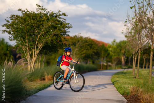 Child on bicycle. Boy in a helmet riding bike. Little cute caucasian boy in safety helmet riding bike in city park. Child first bike. Kid outdoors summer activities. Kid on bicycle. Boy ride a bike.