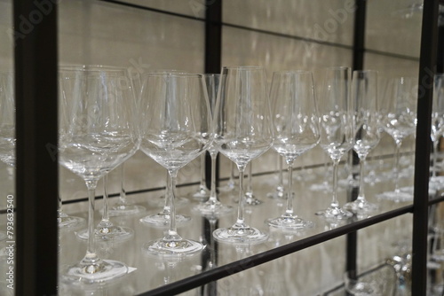Glassware is displayed on the shelf