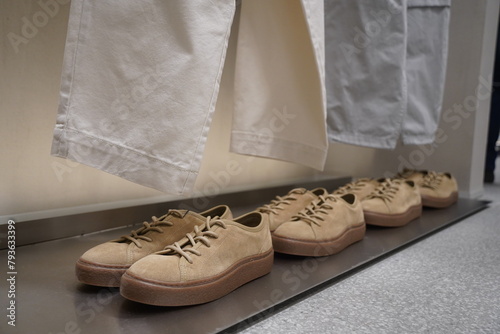 Casual suede shoes are displayed on the shelf.