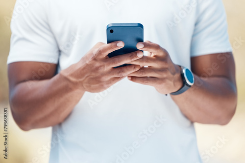 Man, hands and typing with phone in fitness for communication, social media or reading news. Outdoor or closeup of male person on mobile smartphone for online chatting, texting or research on app