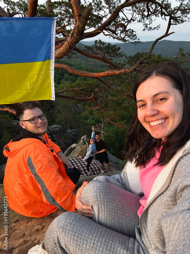 happy friends taking selfie on sunset on the top of the cliff © phpetrunina14