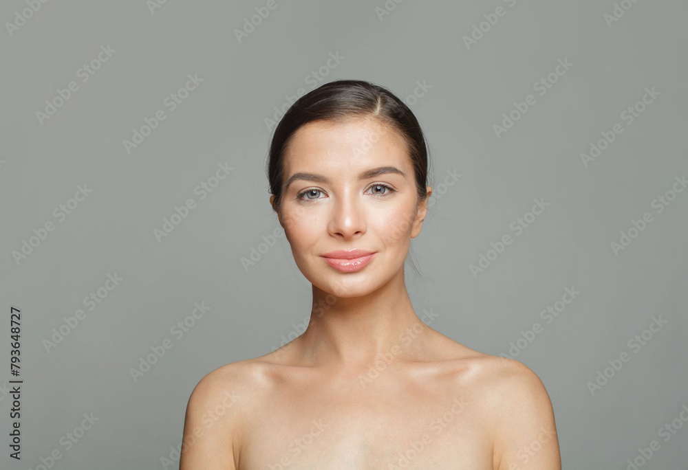 Elegance healthy model woman with beautiful skin and cute smile on white background, studio portrait. Facial treatment, skin care and cosmetology concept