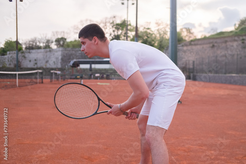 Tennis player with racket on court