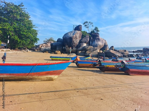 fishing boats moored on the beach