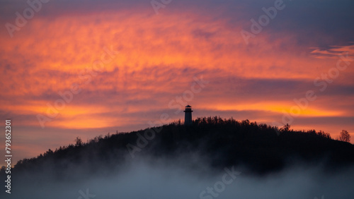 Observation tower siluete during magical sunset with stunning sky over Tišnov city