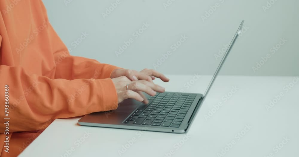 Hands Typing Swiftly on a Modern Laptop in a Professional Workspace Hands Typing Swiftly on a Modern Laptop in a Professional Workspace