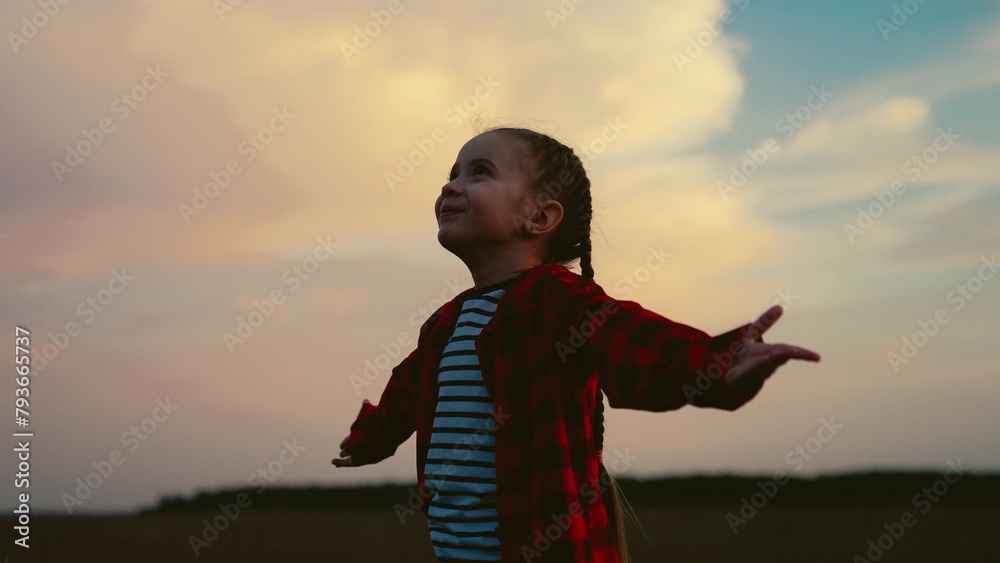 little child kid girl raises her hands sky sunset, religion praying, child praying faithfully, innocent faithful prayer, young hopeful devotion, kid spiritual moment, youthful religious belief, little - obrazy, fototapety, plakaty 