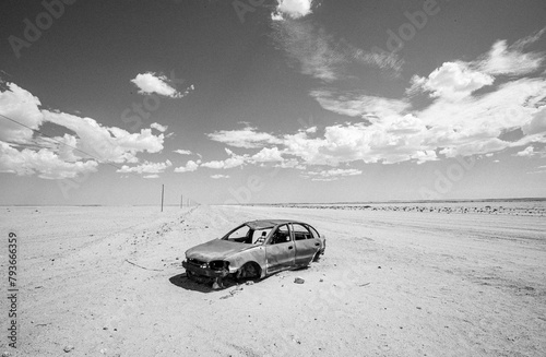 destroyed derelict burned out car in middle of desert, Namibia photo