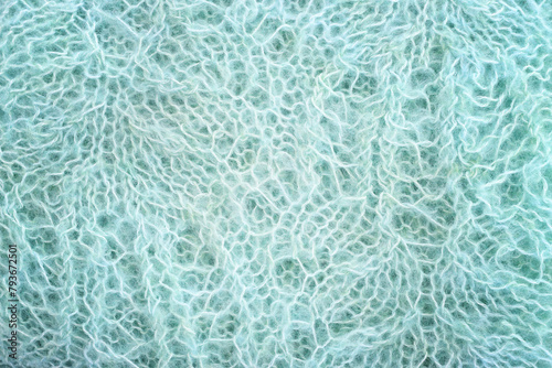 background of blue lace crochet ornament made of wool