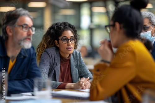 Mature Businessman Leading Company Meeting on Growth Strategies. Diverse Group of Professionals Engaged in Office Conference Discussion on Business Development