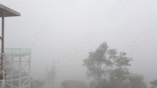 Foggy lookout platform and viewing balcony at the mountainside tourist attraction place photo