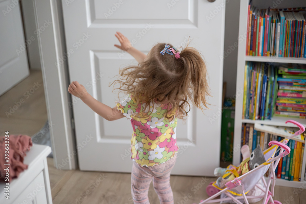 little girl having fun at home, movement and hair - obrazy, fototapety, plakaty 