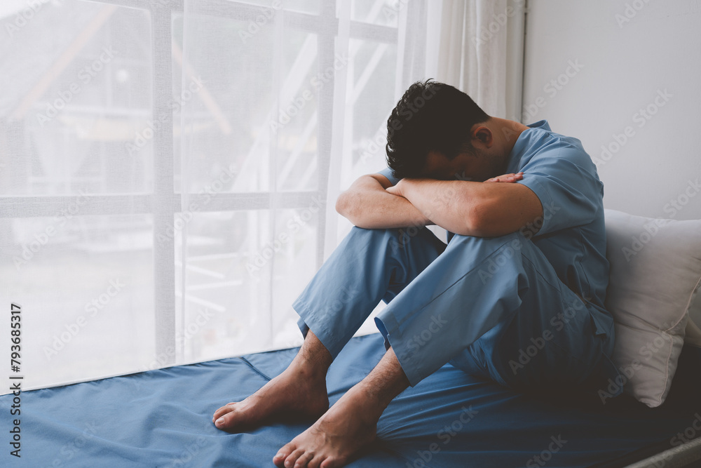 A male patient suffering from stress, migraines, eye strain, headaches, eye problems from working hard and not getting enough rest receives treatment from a doctor at the hospital. A male patient suffering from stress, migraines, eye strain, headaches, eye problems from working hard and not getting enough rest receives treatment from a doctor at the hospital.