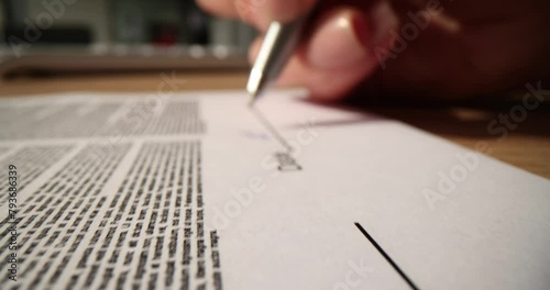 Contract document signed and dated by female businessman