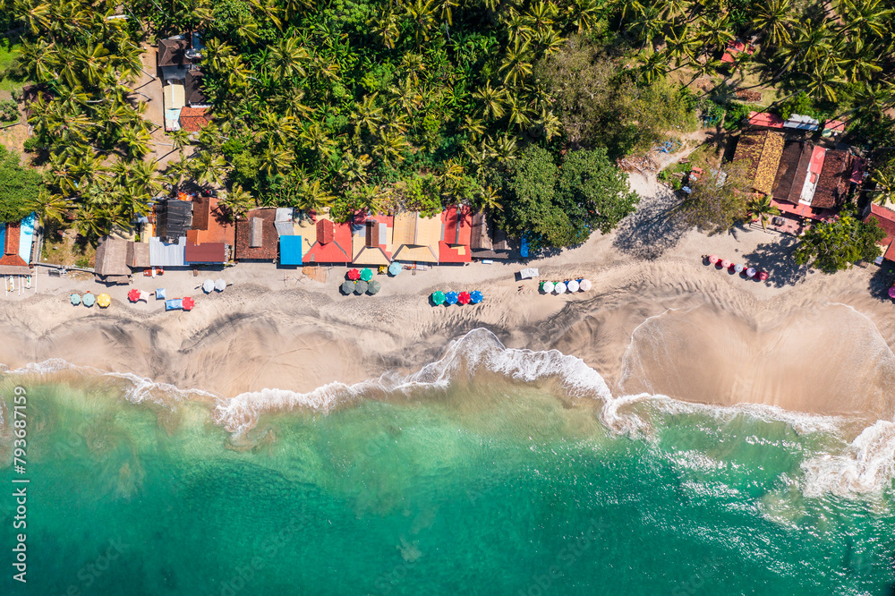 Bali, Indonesia: Aerial overhead view the whie sand Virgin beach and Candidasa in eastern Bali in the famous Indonesian island.