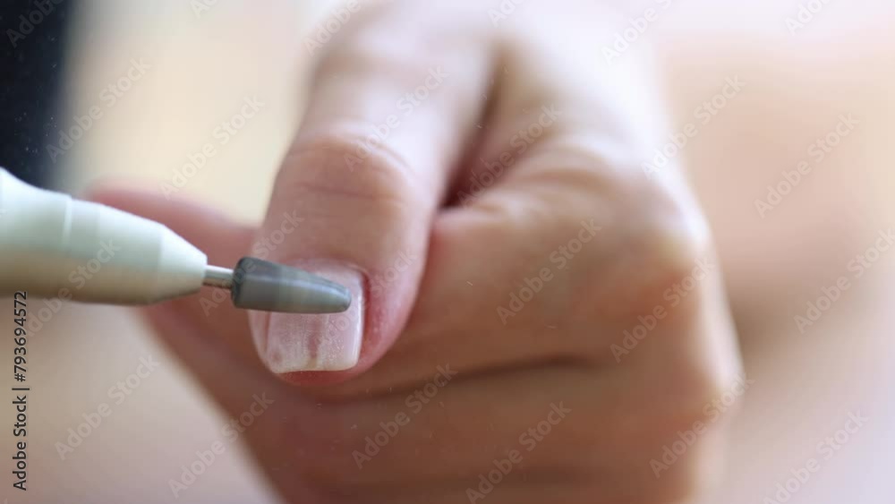 Removing shellac from the nails with fraser. Closeup. Selective focus. 4K Removing shellac from the nails with fraser. Closeup. Selective focus. 4K