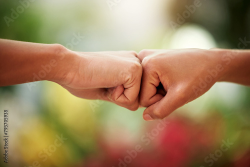 People, fist bump and team with support outdoor, greeting or introduction with trust, deal and community. Friends, mission or thank you with emoji for welcome, connection and loyalty in partnership © peopleimages.com