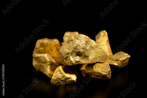 The pure gold ore found in the mine on black background