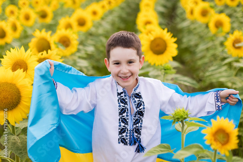 Boy in vyshyvanka with Ukraine flag