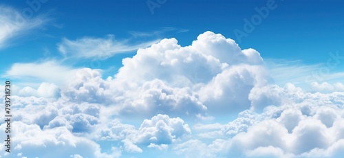Blue sky background with tiny clouds photo