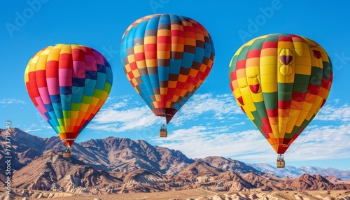 Colorful hot air balloons gently drifting above the breathtaking mountain landscape