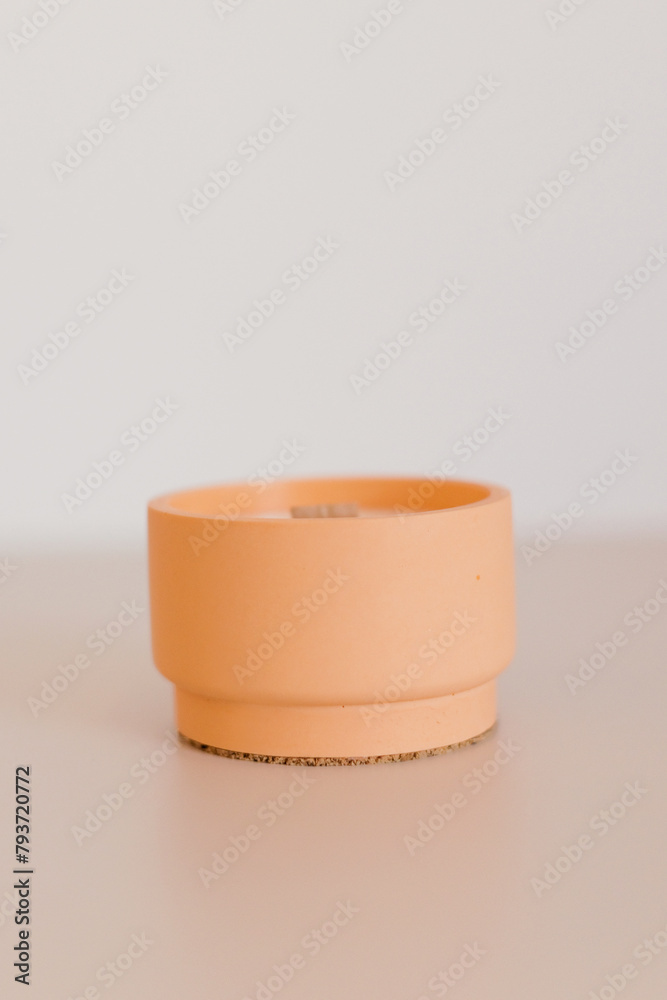 Obraz na plátně Candle in concrete form light background