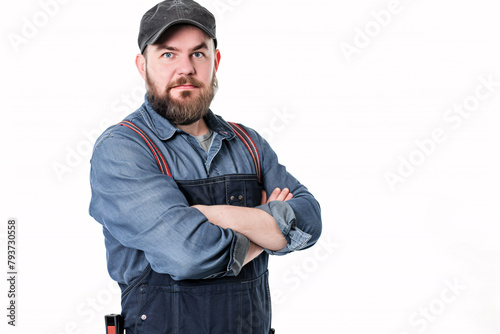 Serious construction worker with beard and crossed arms