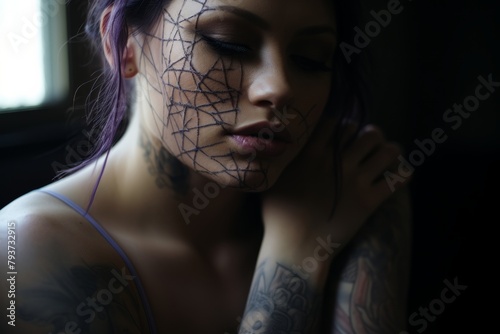 A woman with purple hair and tattoos on her face is reclaiming her identity. Despite scars from self-harm, she exudes strength and resilience