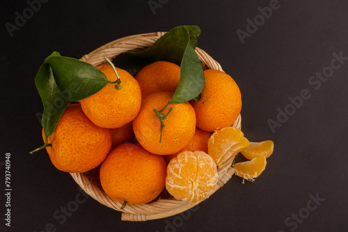 Tangerines in a Basket. Jeruk Santang Tangerine. photo