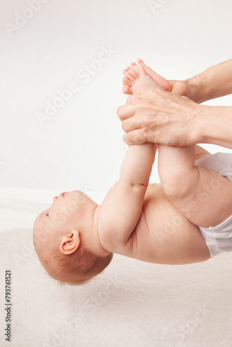 Physiotherapist Conducting Development Exercises with Infant in Clinic