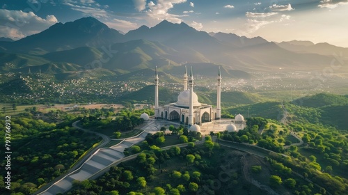 Aerial shot of Islamabad, the capital city of Pakistan showing the landmark Shah Faisal Mosque and the lush green mountains of Margala Hills