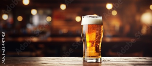 Glass of beer on wooden surface
