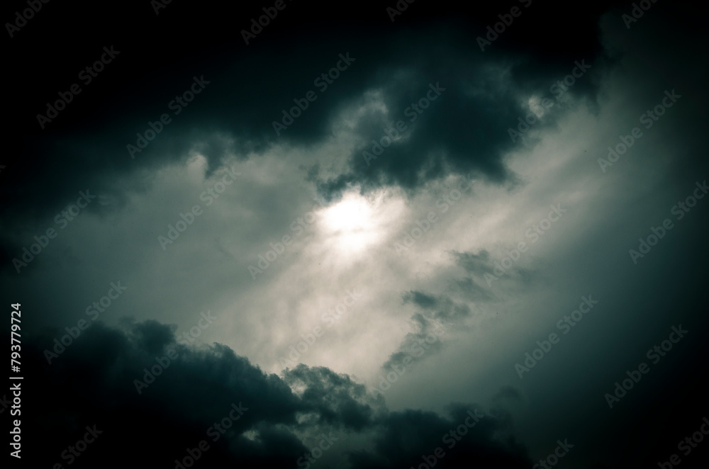 Stormy sky with dark clouds. Abstract nature background. Toned.