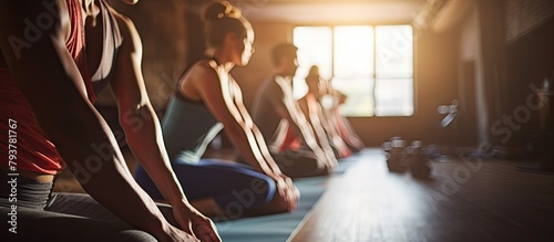 several people sit row yoga mats photo