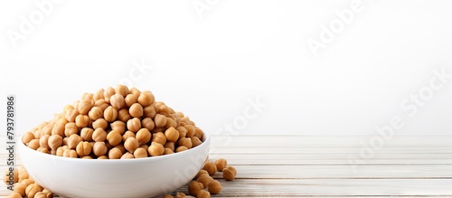 Close-up of chickpeas in bowl on wooden surface