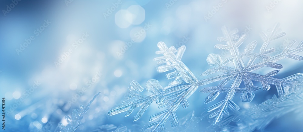 Snowflake on blue backdrop with blurred scene Snowflake on blue backdrop with blurred scene