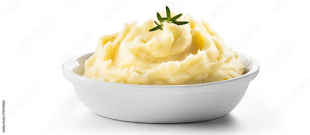 Bowl of Mashed Potatoes with Rosemary Sprig Bowl of Mashed Potatoes with Rosemary Sprig