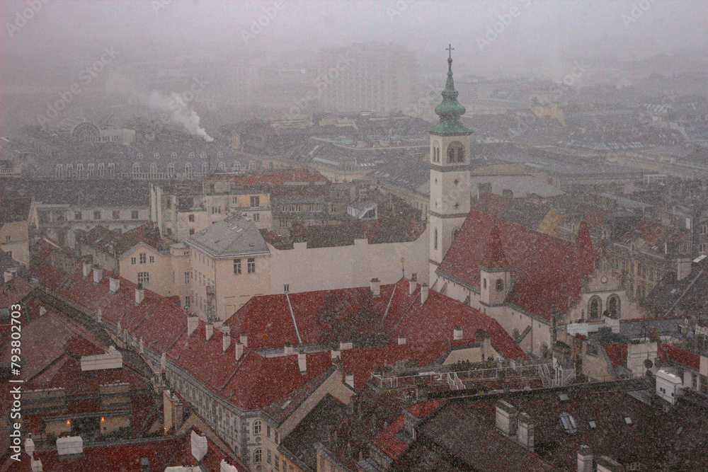 The Franciscan Church is a Roman Catholic parish in Vienna, Austria. View from the observation deck of St. Stephen's cathedral during heavy snowfall