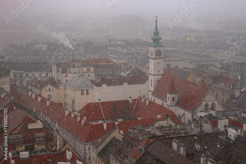 The Franciscan Church is a Roman Catholic parish in Vienna, Austria. View from the observation deck of St. Stephen's cathedral during heavy snowfall
