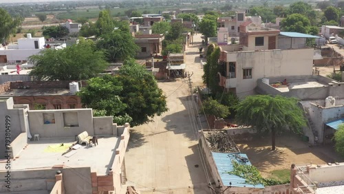 drone shot of too many stone houses in the streets of village jhalamand jodhpur rajasthan. stone houses in village of jodhpur city rajasthan. a colony or nagar located in jodhpur rajasthan. drone shot photo