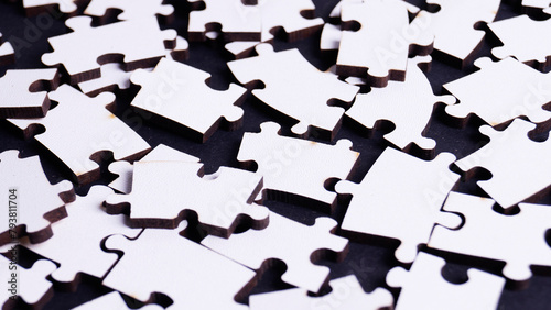 white wooden puzzles on a colored background