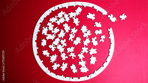 white wooden puzzles on a colored background