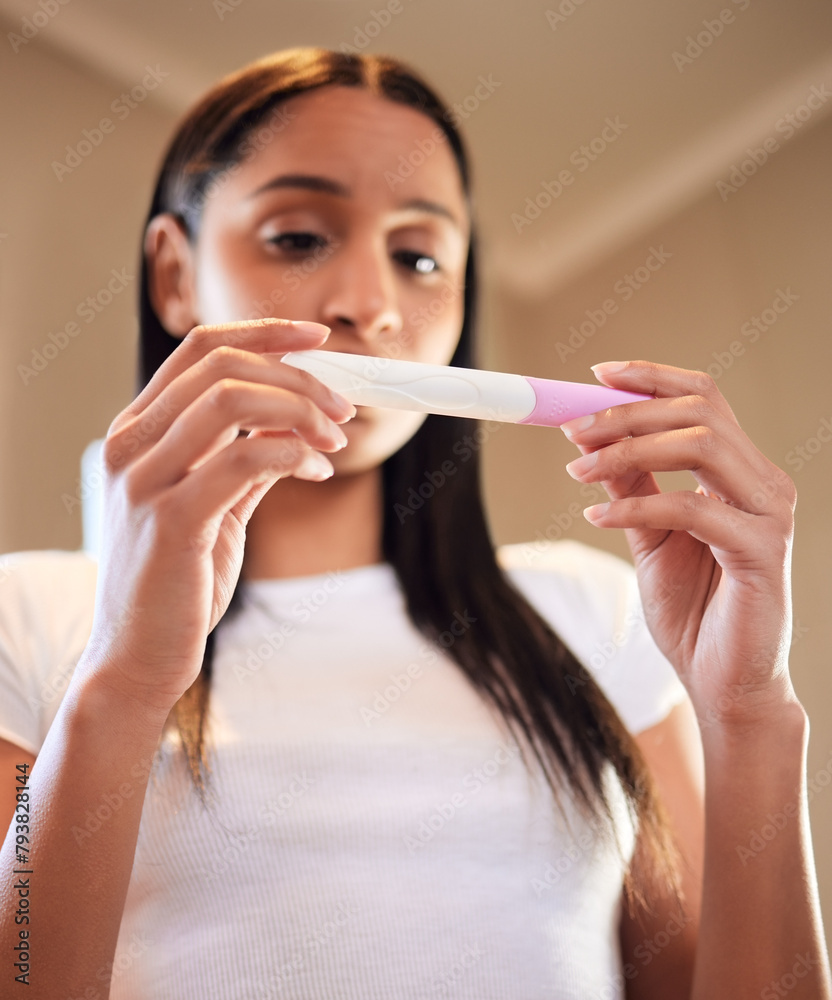 Anxiety, woman and hands with pregnancy test in home for results, scared or nervous for ivf fail. Maternity, stress and serious person waiting with worry, fear and frustrated for mistake in low angle Anxiety, woman and hands with pregnancy test in home for results, scared or nervous for ivf fail. Maternity, stress and serious person waiting with worry, fear and frustrated for mistake in low angle