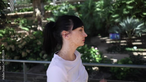 young adult woman running training outdoors preparing for physical improvement. Video woman in profile and frontal running