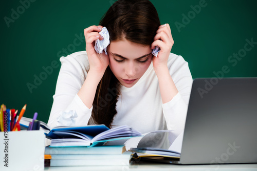 The student girl is studying in the classroom. Sad college student. Tired school girl. Tired student having too much. Hard learning. College student worried. Young women studying hard. © Volodymyr