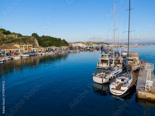 Sunny morning cityscape of capital of Corfu island. Beautiful summer view of Kerkira town. Stunning seascape of Ionian Sea, Greece, Europe. Traveling concept background.
