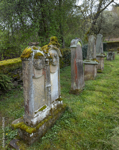 Tombstones at historical and abandoned Jewish cemetry at Lösnich Graveyard with gate with Davidstar. Rhineland-Palatinate. River Moselle area.
