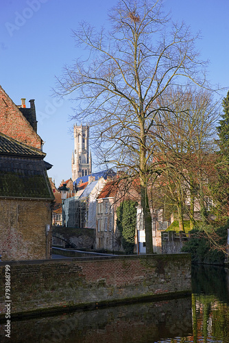 The junction of the Groenerei and Coupure canals: view towards the centre of Bruges with the Belfort tower in the distance.