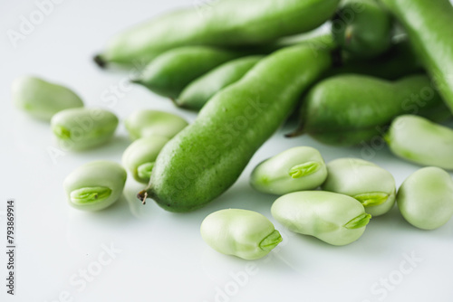 fresh greens broad beans fava on a white background