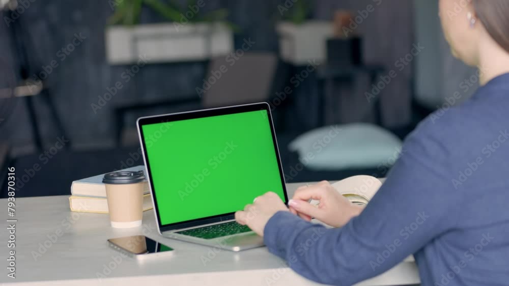 Woman Working With Green Screen Laptop in Modern Room-Office. Chroma Key Display Computer Woman Working With Green Screen Laptop in Modern Room-Office. Chroma Key Display Computer